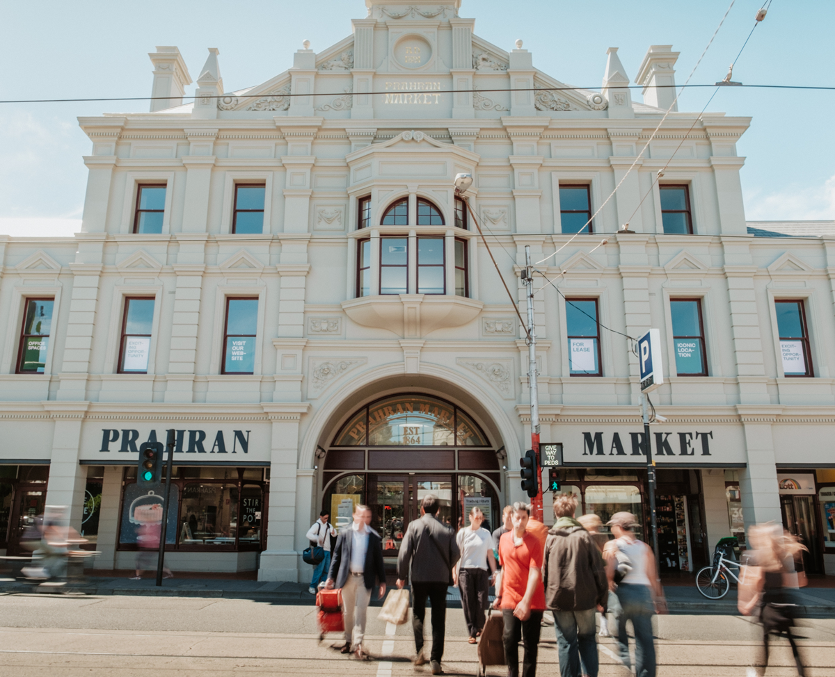 Prahran Market historic facade and people food shopping